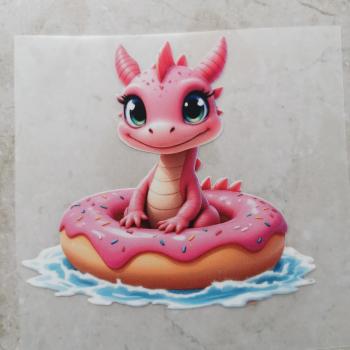 Bügelbild rosa Drache im Schwimmring