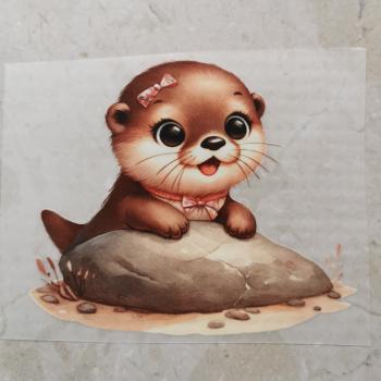 Bügelbild knuffiger Otter auf Stein