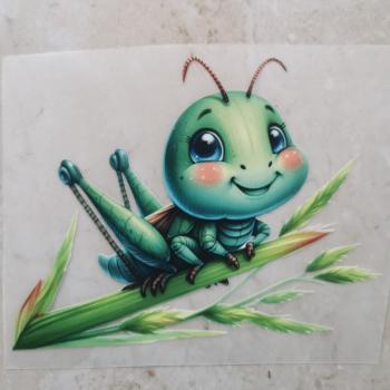 Bügelbild süße Heuschrecke auf Schilf
