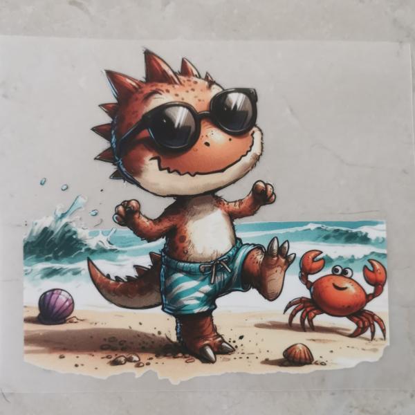 Bügelbild Stranddino tanzend