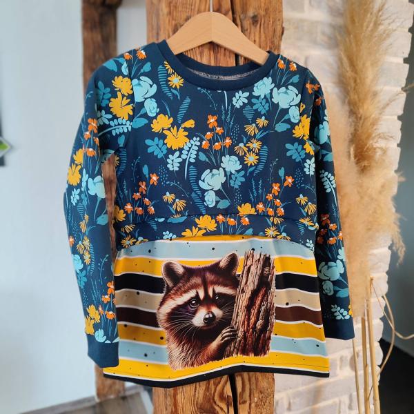 Bügelbild Waschbär Baumstamm