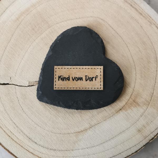 Label Kind vom Dorf